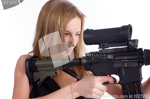 Image of Pretty woman with rifle