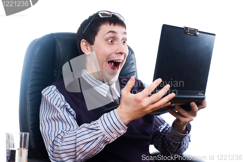 Image of Portrait of a young businessman with laptop