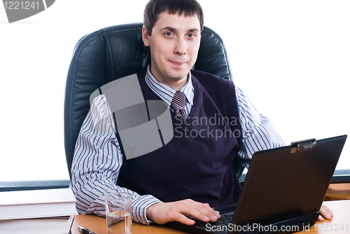 Image of Portrait of a young businessman with laptop