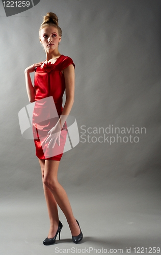 Image of Sexy slim woman in red dress