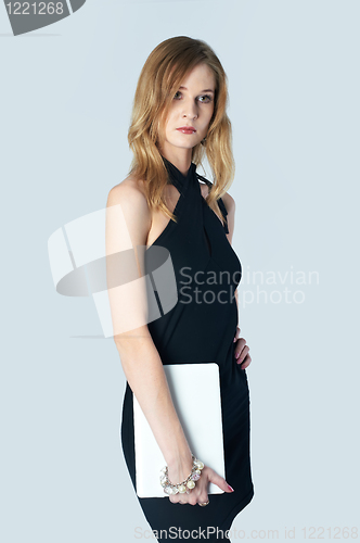 Image of Attractive blonde girl with laptop