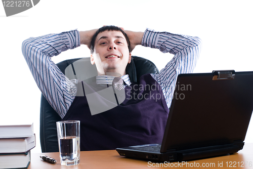 Image of Portrait of a young businessman with laptop
