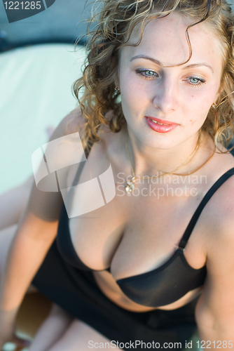 Image of Young woman on roof