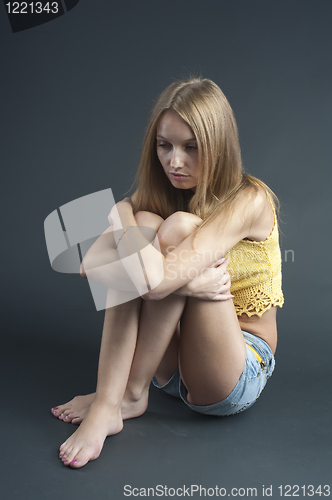 Image of Sitting pretty girl