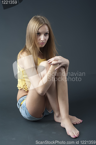 Image of Sitting pretty girl