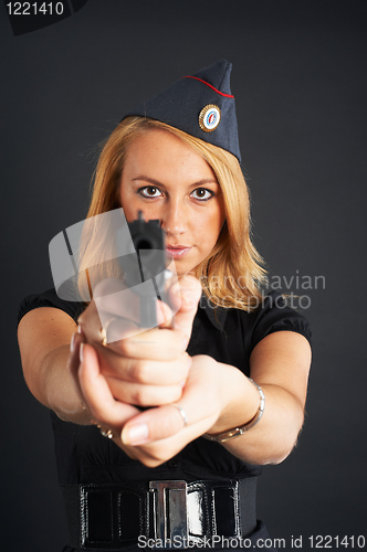 Image of Pretty woman with a gun