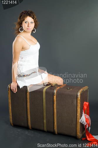 Image of Beautiful girl with suitcase