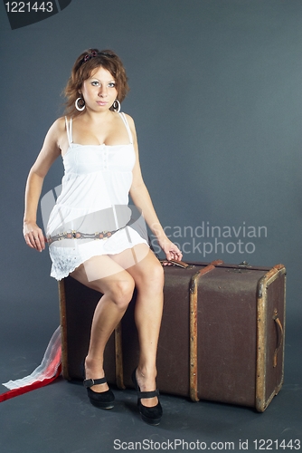 Image of Beautiful girl with suitcase