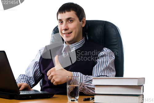 Image of Portrait of a young businessman with laptop