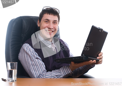Image of Portrait of a young businessman with laptop