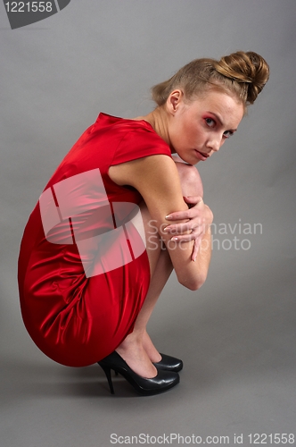Image of Sexy slim woman in red dress