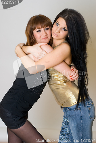Image of Two beautiful women posing together