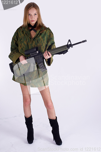 Image of Woman with gun on white