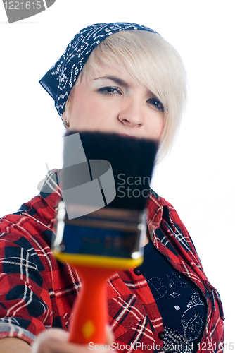 Image of Young woman with paintbrush