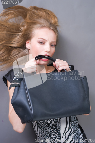 Image of Sexy fashionable woman with bag