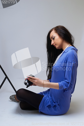 Image of Young woman with camera