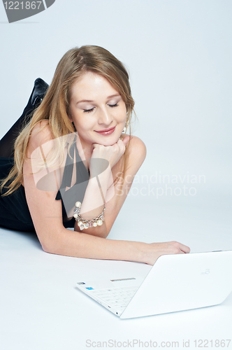 Image of Attractive blonde girl with laptop