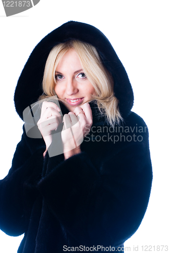 Image of Young woman in fur coat