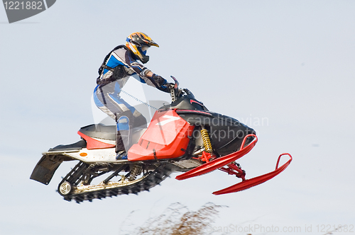 Image of Flying sportsman on snowmobile