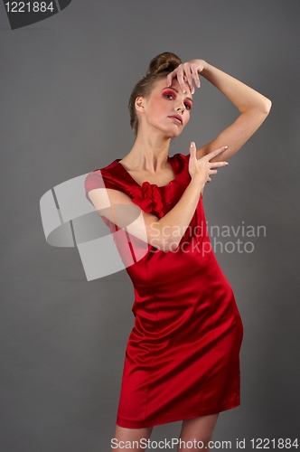 Image of Sexy slim woman in red dress