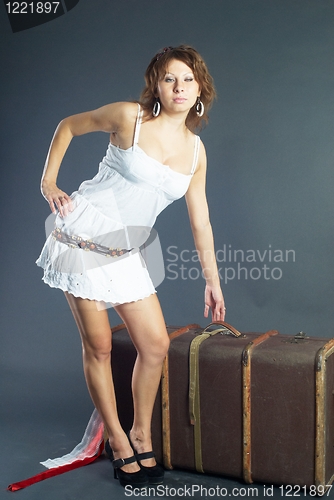 Image of Beautiful girl with suitcase