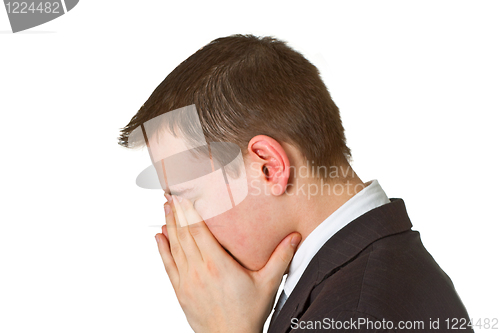 Image of Businessman hiding his face in shame