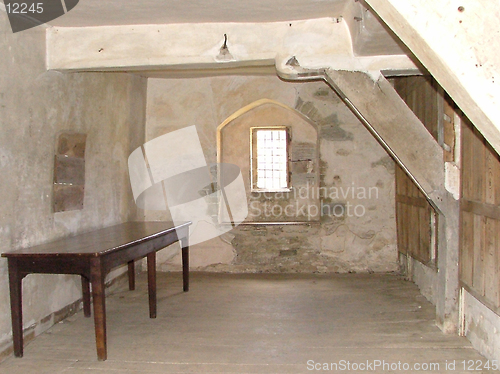 Image of castle internal, table, bare room