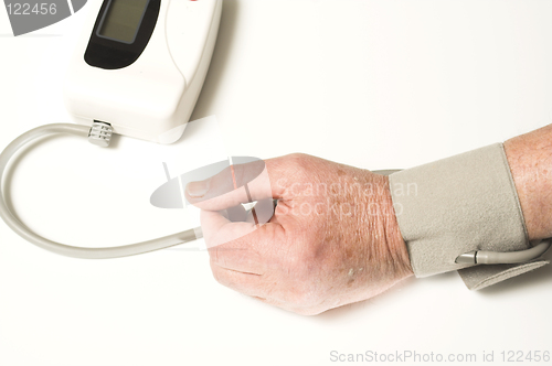 Image of senior taking blood pressure