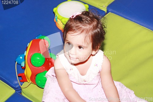 Image of Baby playing with toys