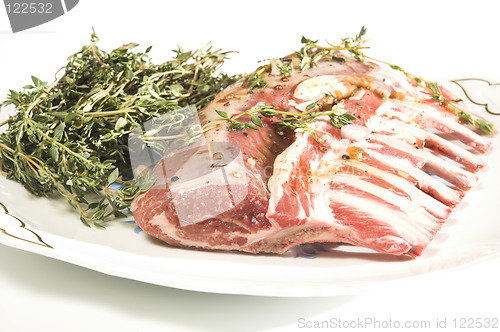 Image of lamb rib over white close up