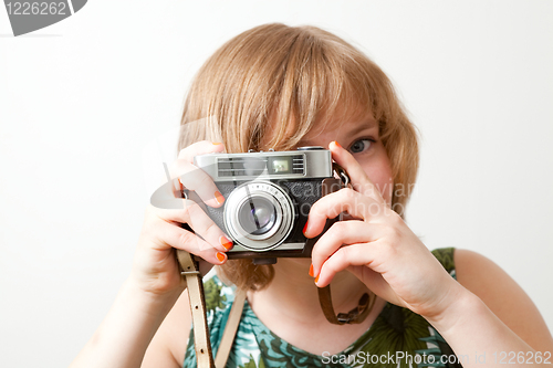 Image of Woman with a vintage camera