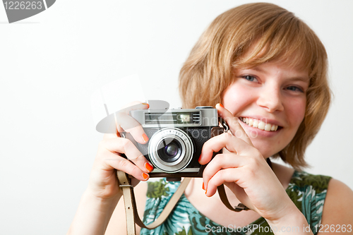 Image of Woman with a vintage camera