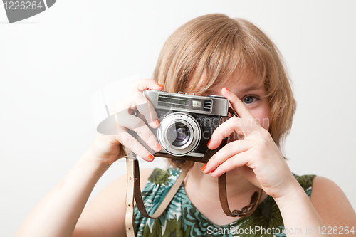 Image of Woman with a vintage camera