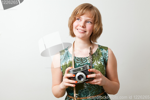 Image of Woman with a vintage camera