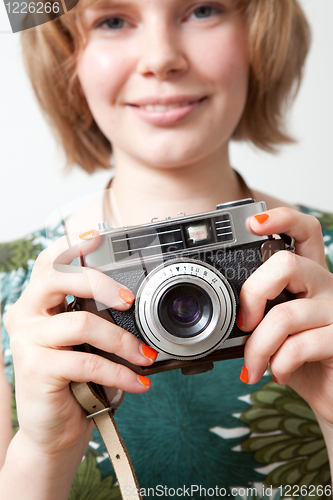 Image of Woman with a vintage camera