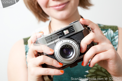 Image of Woman with a vintage camera