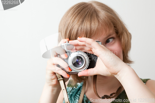 Image of Woman with a vintage camera