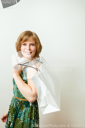 Image of Young woman with shopping bag