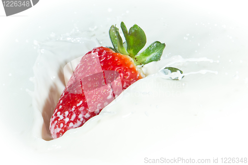 Image of strawberry splashing into milk