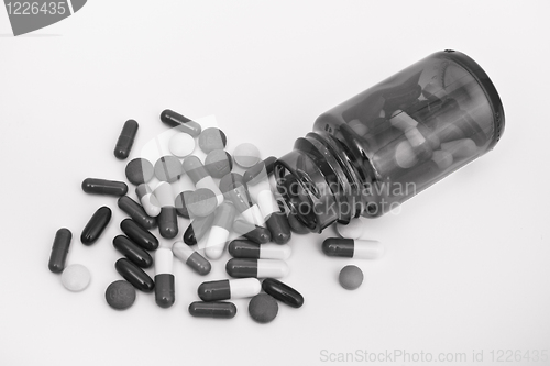 Image of pills in glass container