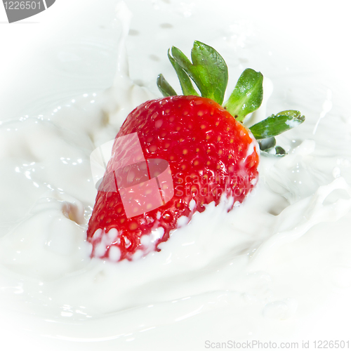 Image of strawberry splashing into milk