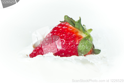 Image of strawberry splashing into milk