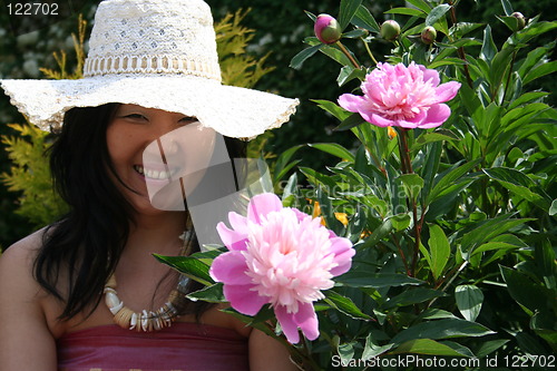 Image of Girl surrounded of flowers