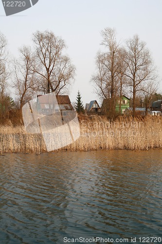 Image of View on the river and village at dull day