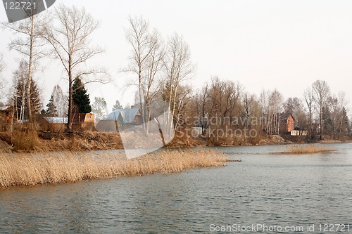 Image of View on the river and village at dull day