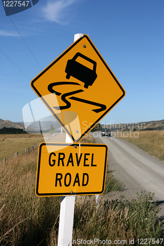 Image of gravel road warning