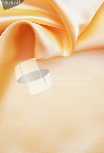 Image of  Smooth elegant golden silk as background 