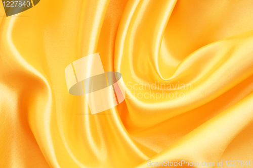 Image of Smooth elegant golden silk as background 