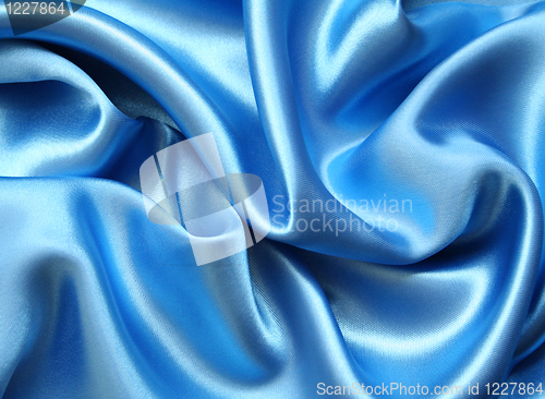 Image of Smooth elegant blue silk as background 