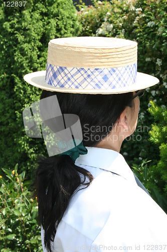 Image of Girl with hat and pony-tail